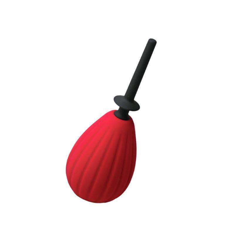 Enemas & Douches: red silicone enema bulb with black plunger.