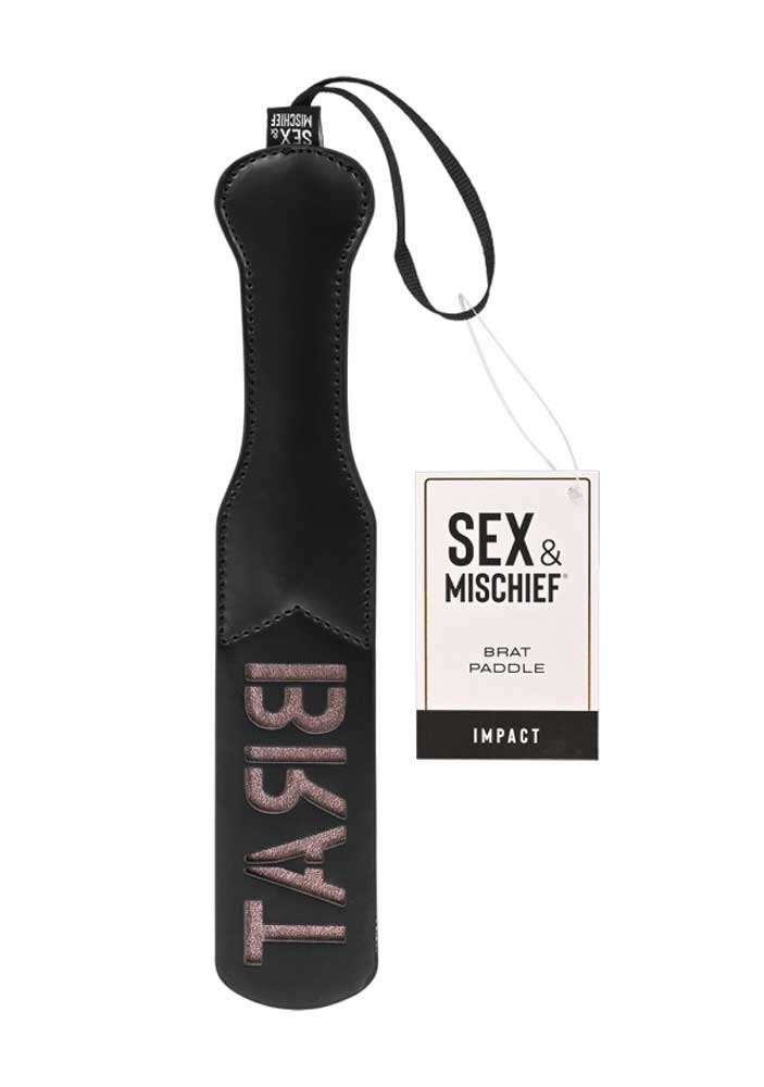 Brat Paddle in black and rose gold with "BRAT" imprint, made of faux leather, includes wrist loop.