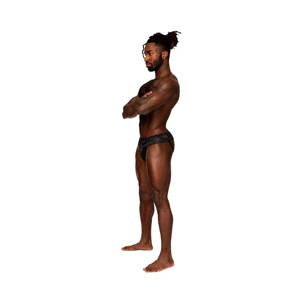 Male model wearing Male Power Sassy Lace Skirt Jock in black, side view, size L/XL