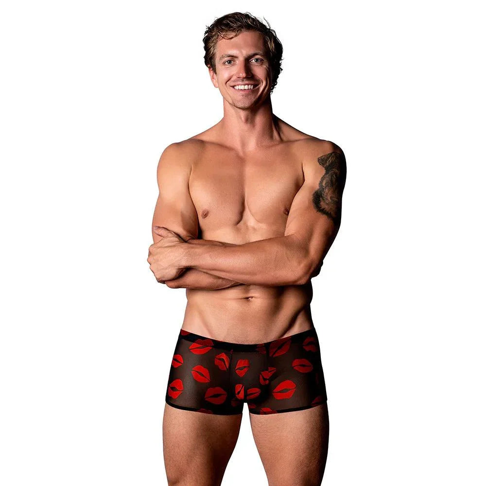 Male Power sheer mini shorts with red lips pattern on male model with tattoo and smiling face