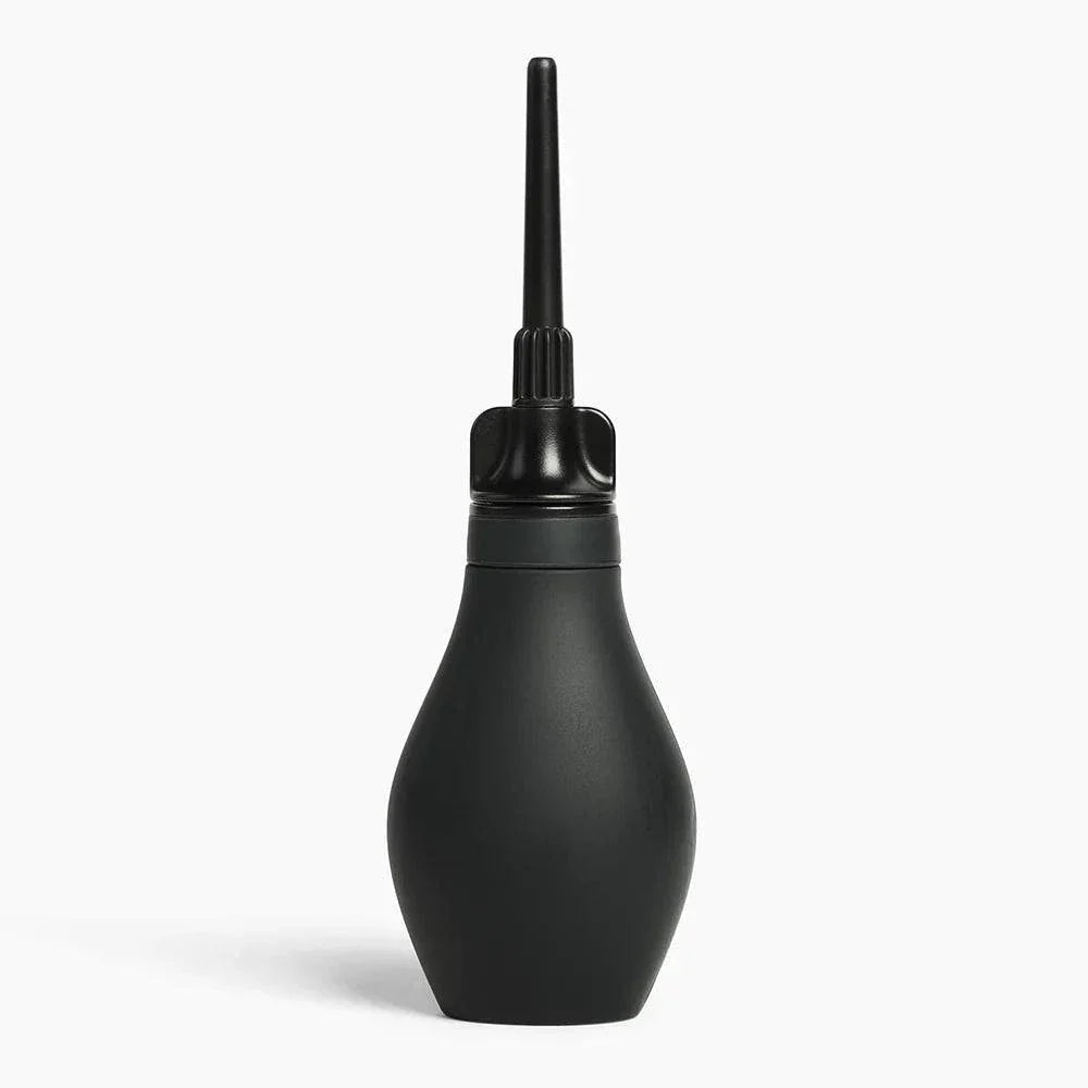 Black Du Douche Midnight silicone douche bulb with ergonomic grip and detachable nozzle on white background