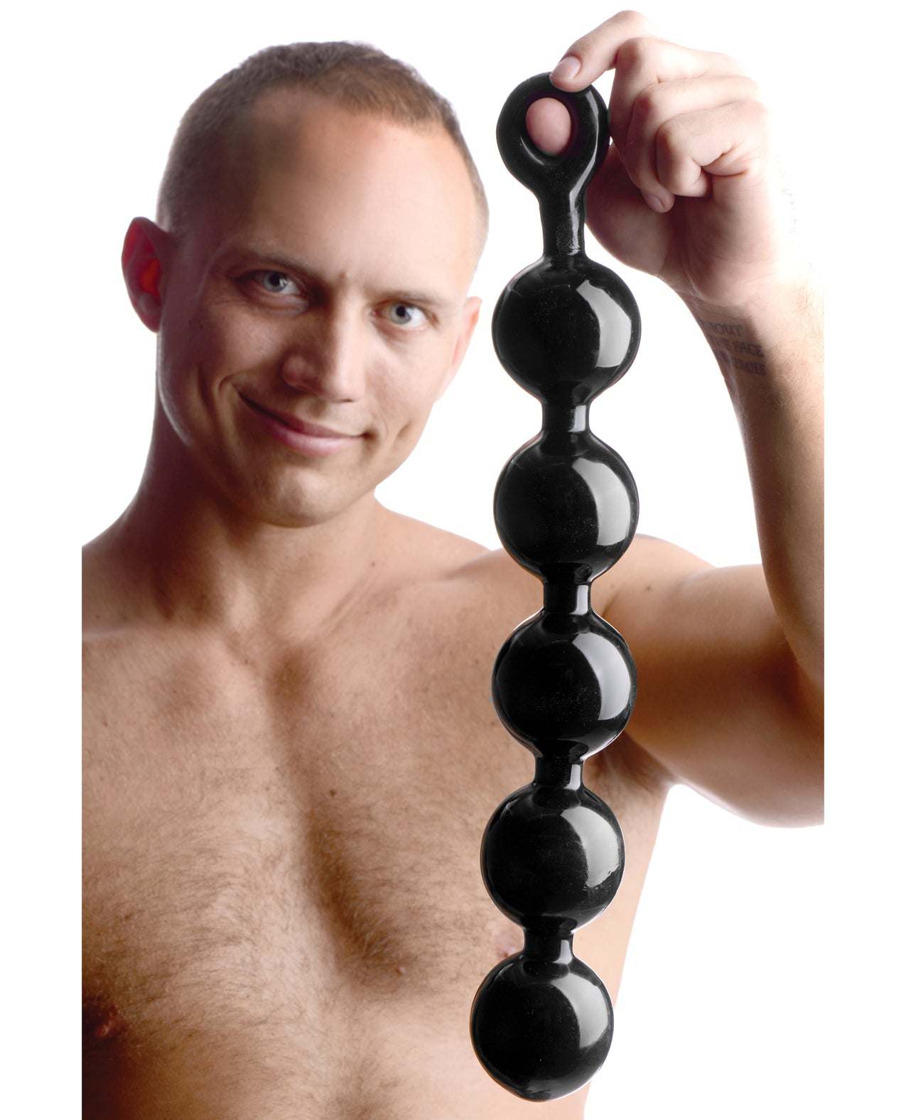Master Series Black Baller anal beads with five large black spheres and easy-pull ring handle held by shirtless man