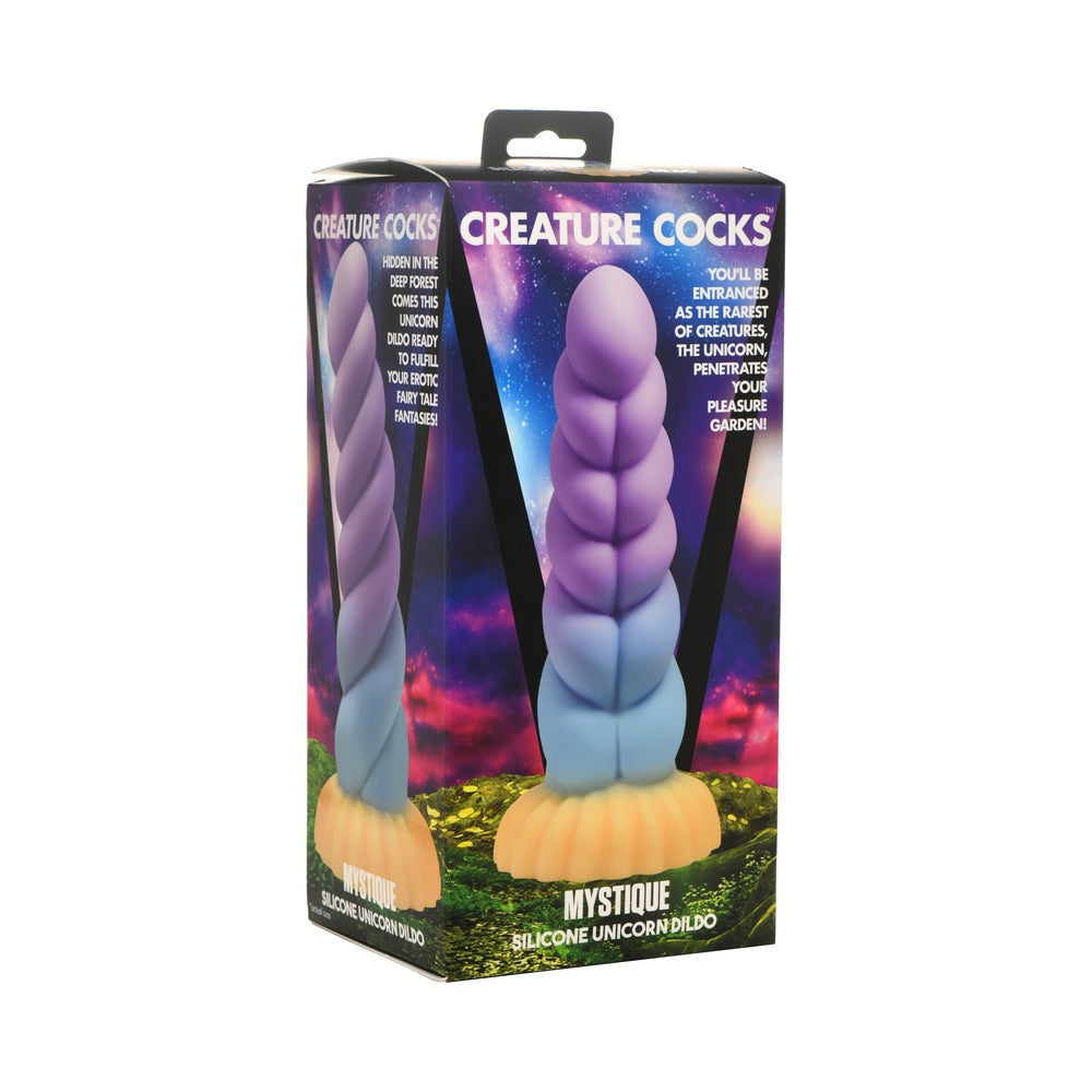 Creature Cocks Mystique silicone unicorn dildo with twisted horn in blue, purple, and orange hues and suction base.