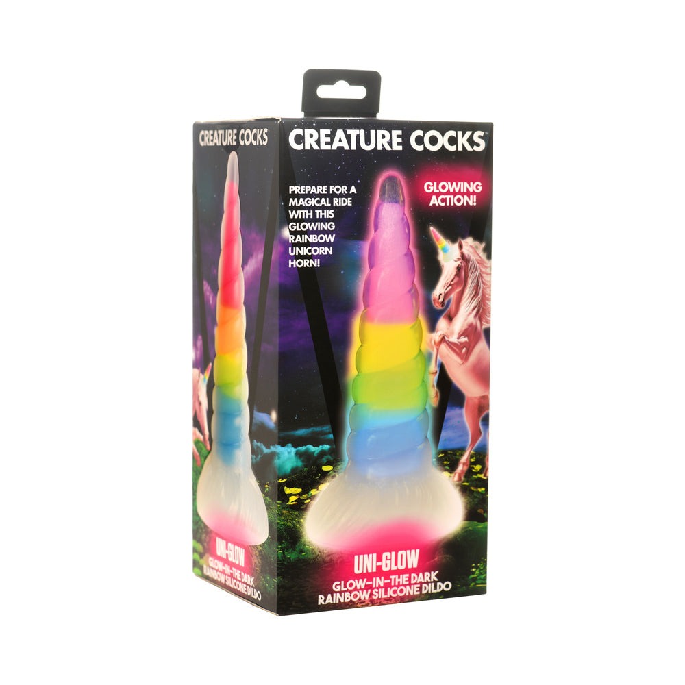 Creature Cocks Uni-Glow glow-in-the-dark rainbow silicone dildo with magical unicorn horn design and suction cup base.