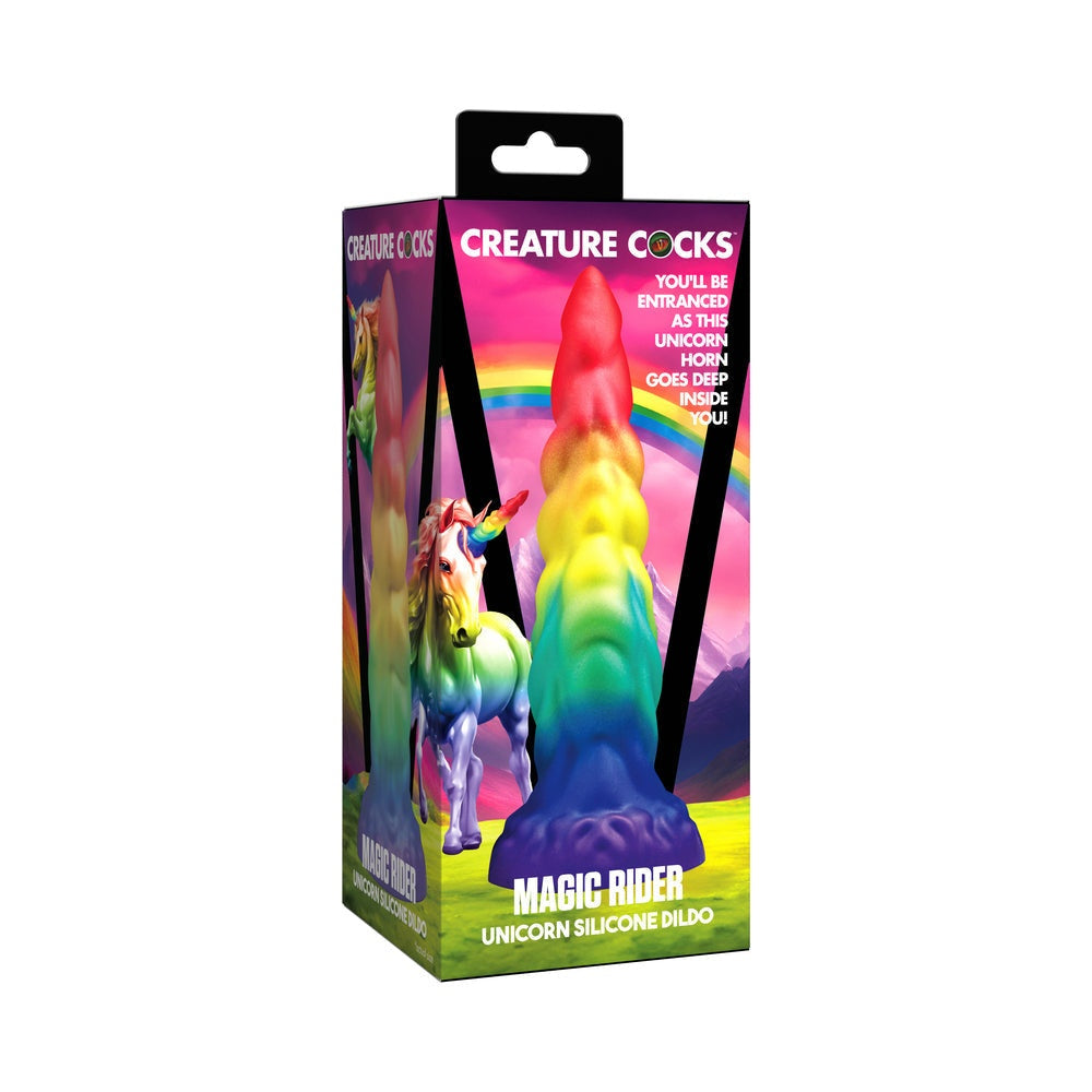 Creature Cocks Rainbow Horn silicone dildo in vibrant rainbow colors with unicorn horn design and suction cup base, packaged in a colorful box.