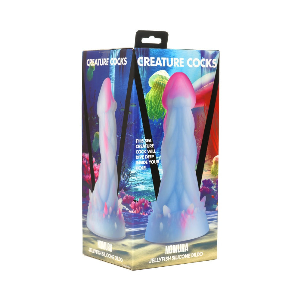 Creature Cocks Nomura Jellyfish silicone dildo in pale blue and pink with suction base and textured design in packaging