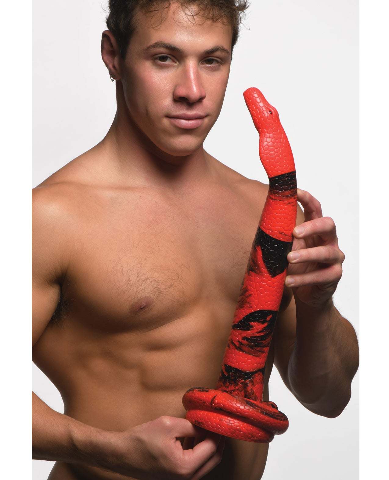 Man holding Creature Cocks King Cobra X-Large red and black silicone dildo with suction base