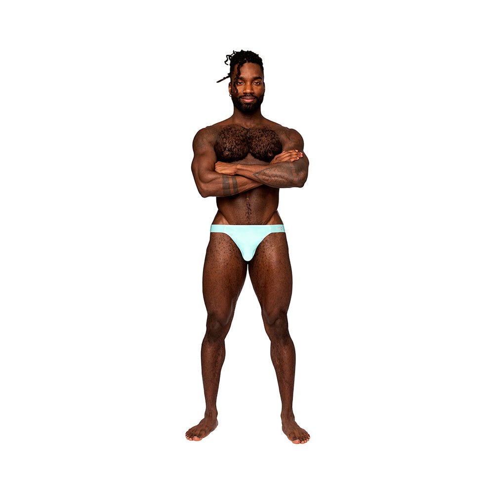 Male Power Easy Breezy Thong Sleeve in aqua worn by male model with low cut waist and satin waistband