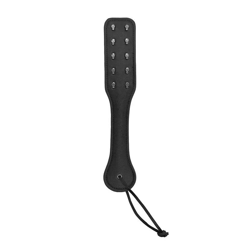 Ouch! Skulls & Bones black bonded leather paddle with metal skull designs and wrist strap