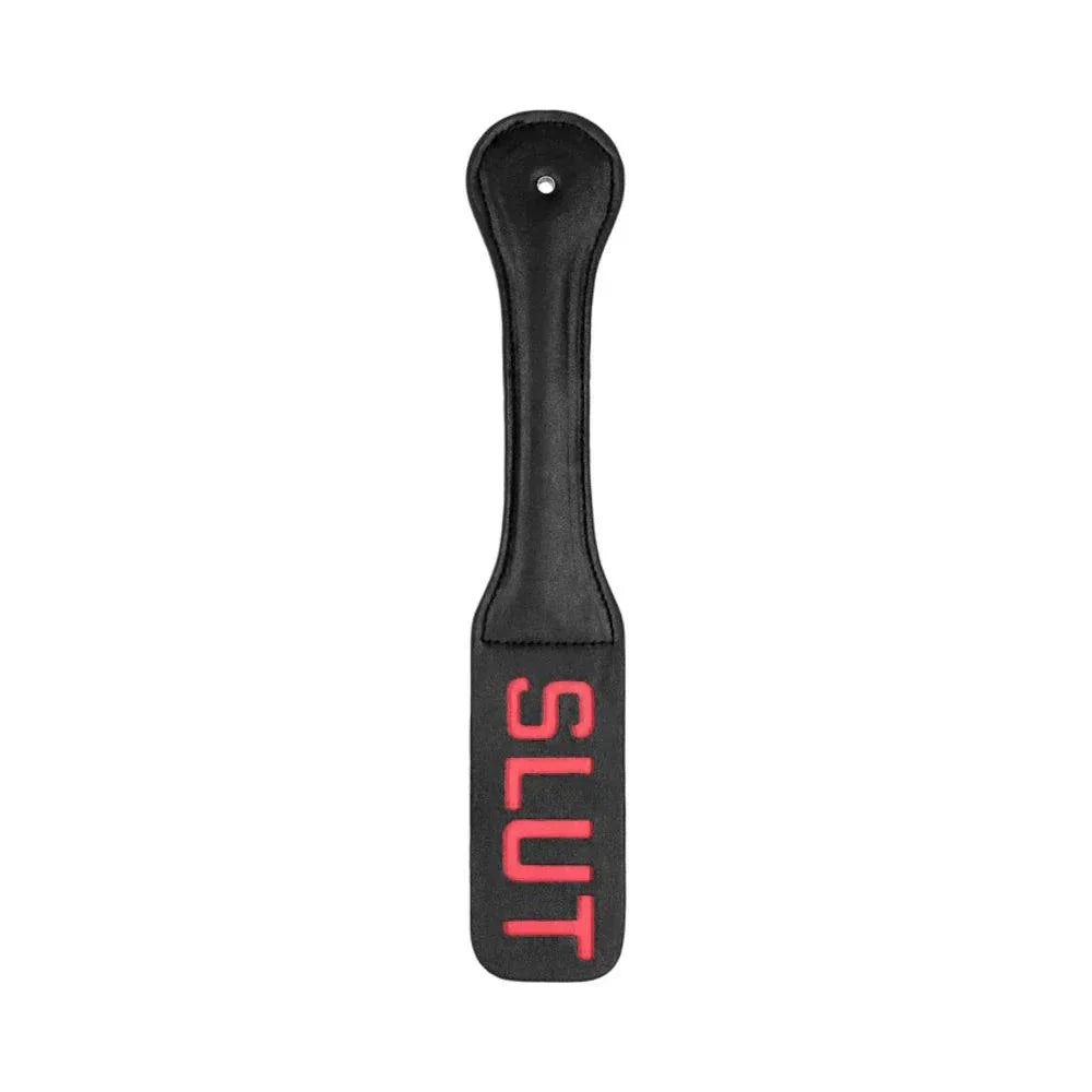 Black leather Ouch! 'Slut' Paddle with red reversed lettering designed to leave an imprint on skin.