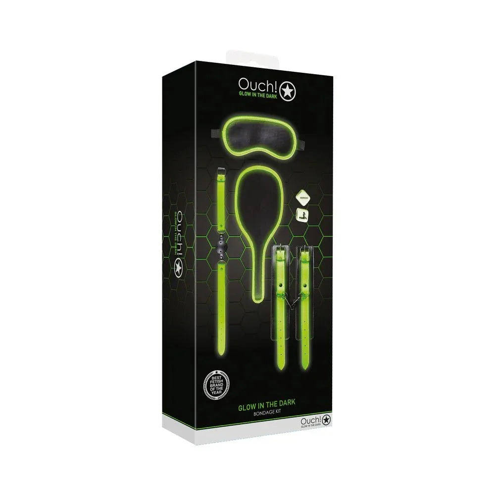 Glow in the dark neon green 7-piece bondage kit with wrist cuffs, ball gag, paddle, eye mask, and dice in black packaging