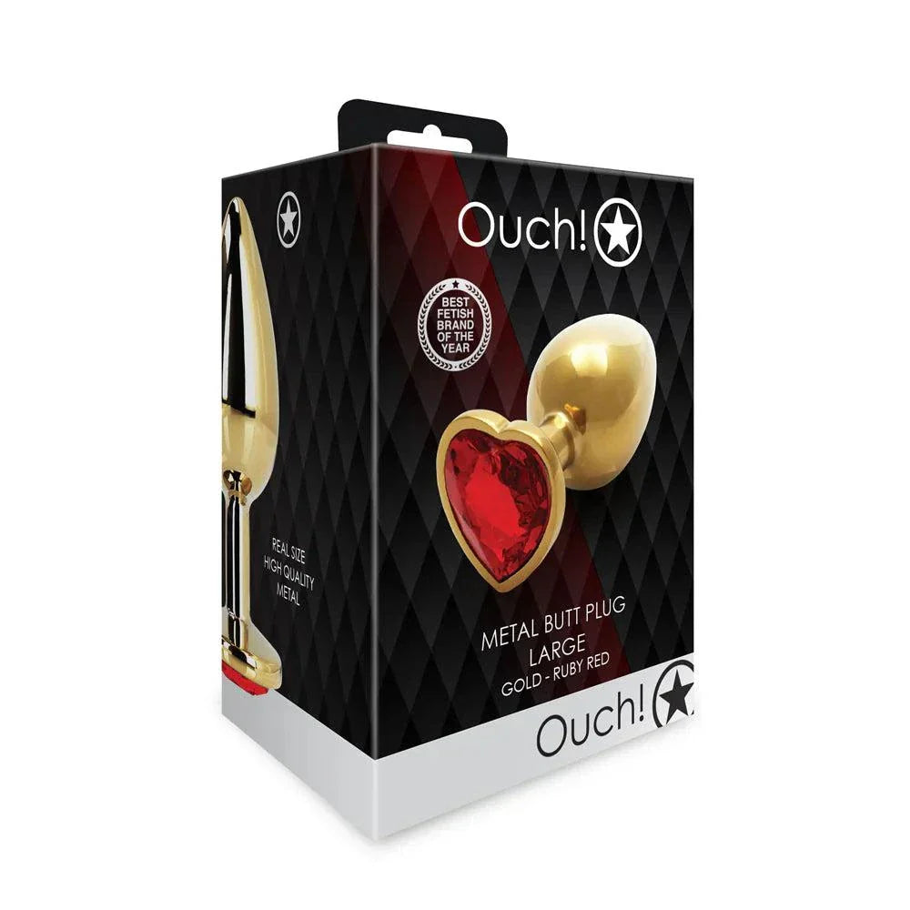 Ouch! Heart Gem Butt Plug large metal toy in gold with ruby red heart-shaped gem, featuring tapered tip and flared base for safe use.