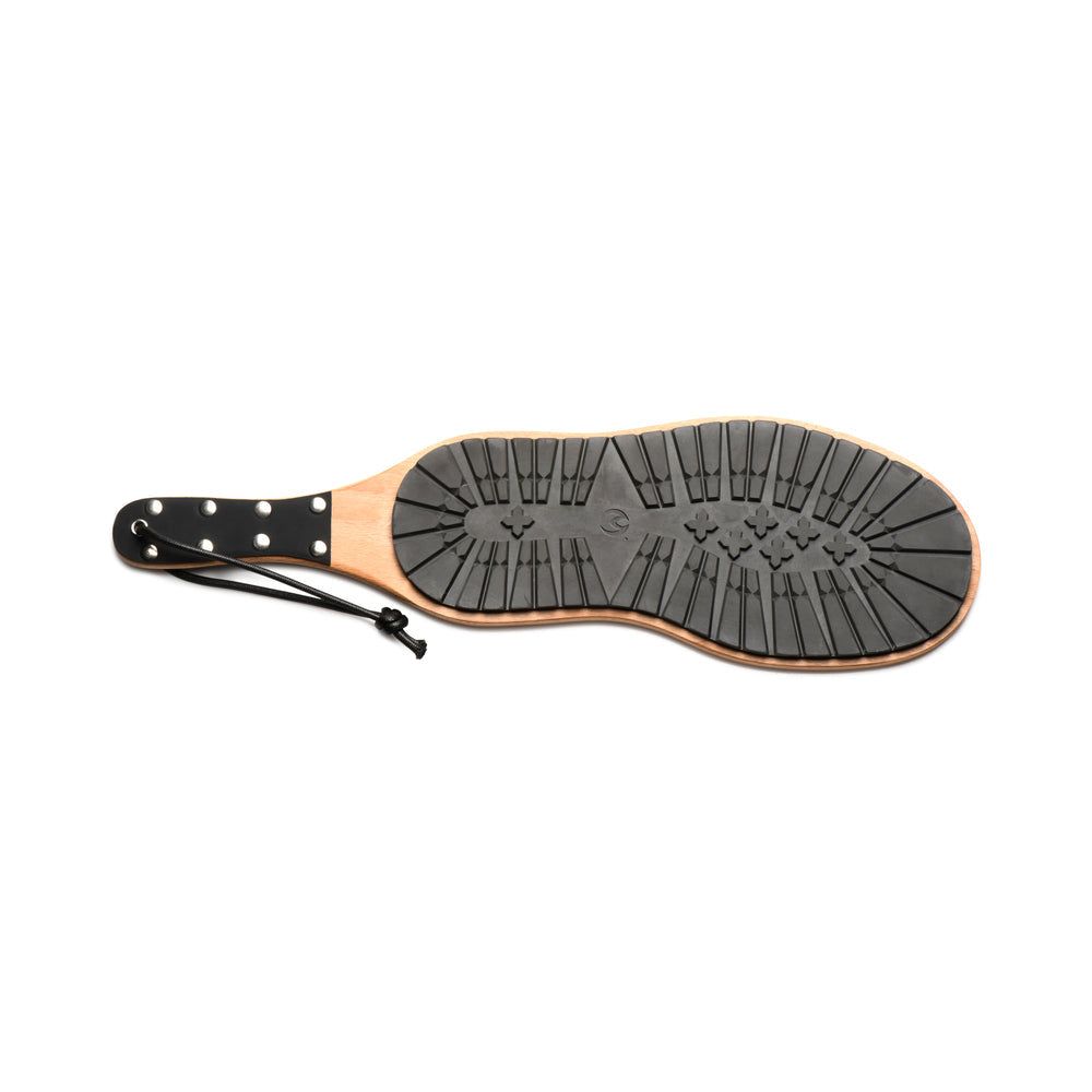 Master Series Tread Boot Paddle with rubber boot print and smooth wood sides, vegan leather handle, and hanging loop for BDSM play.