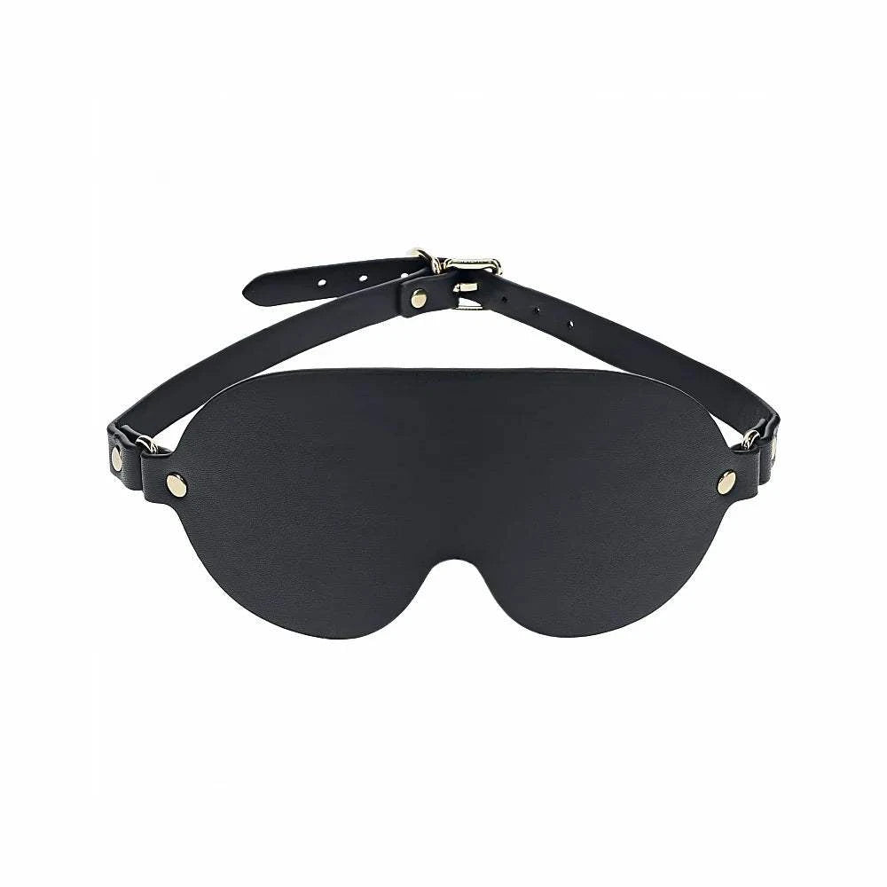 Ouch! International London Collection Blindfold in black bonded leather with adjustable strap and iridescent hardware finish.