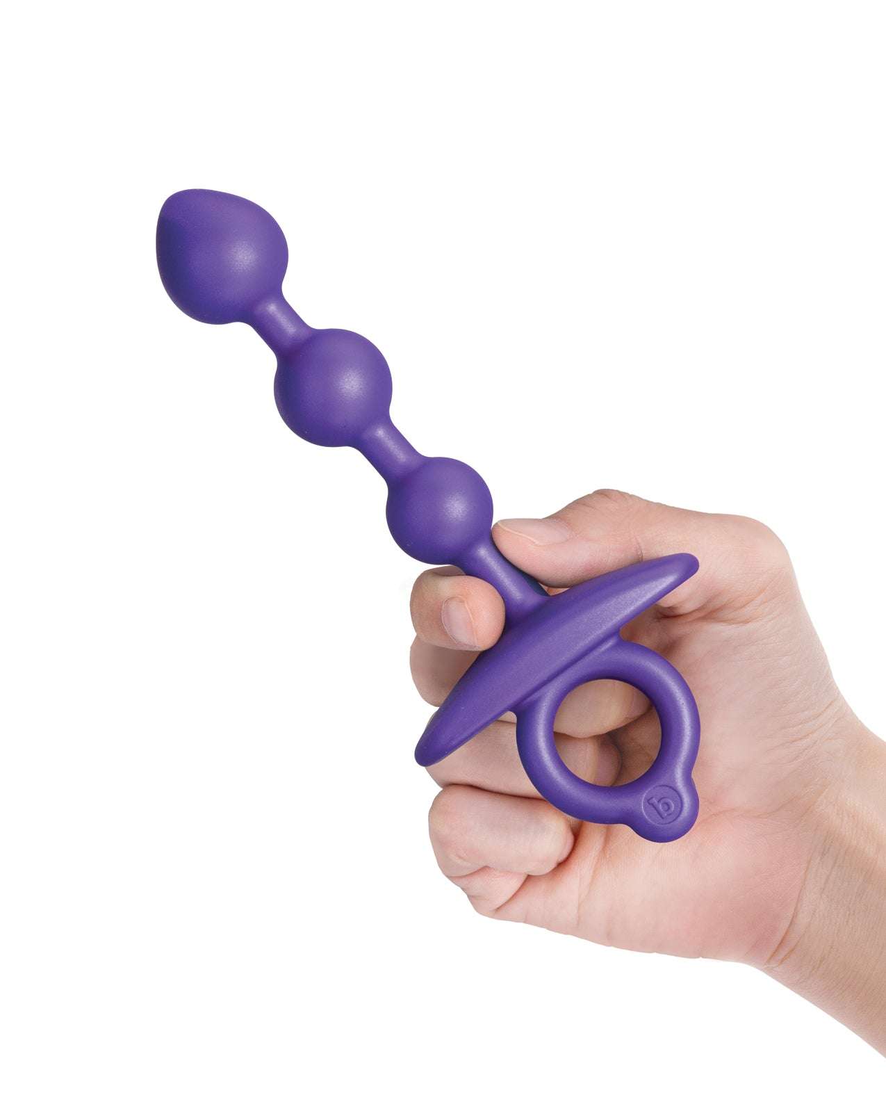 b-Vibe Zip Silicone Anal Beads in purple held in hand with tapered beads and finger ring handle