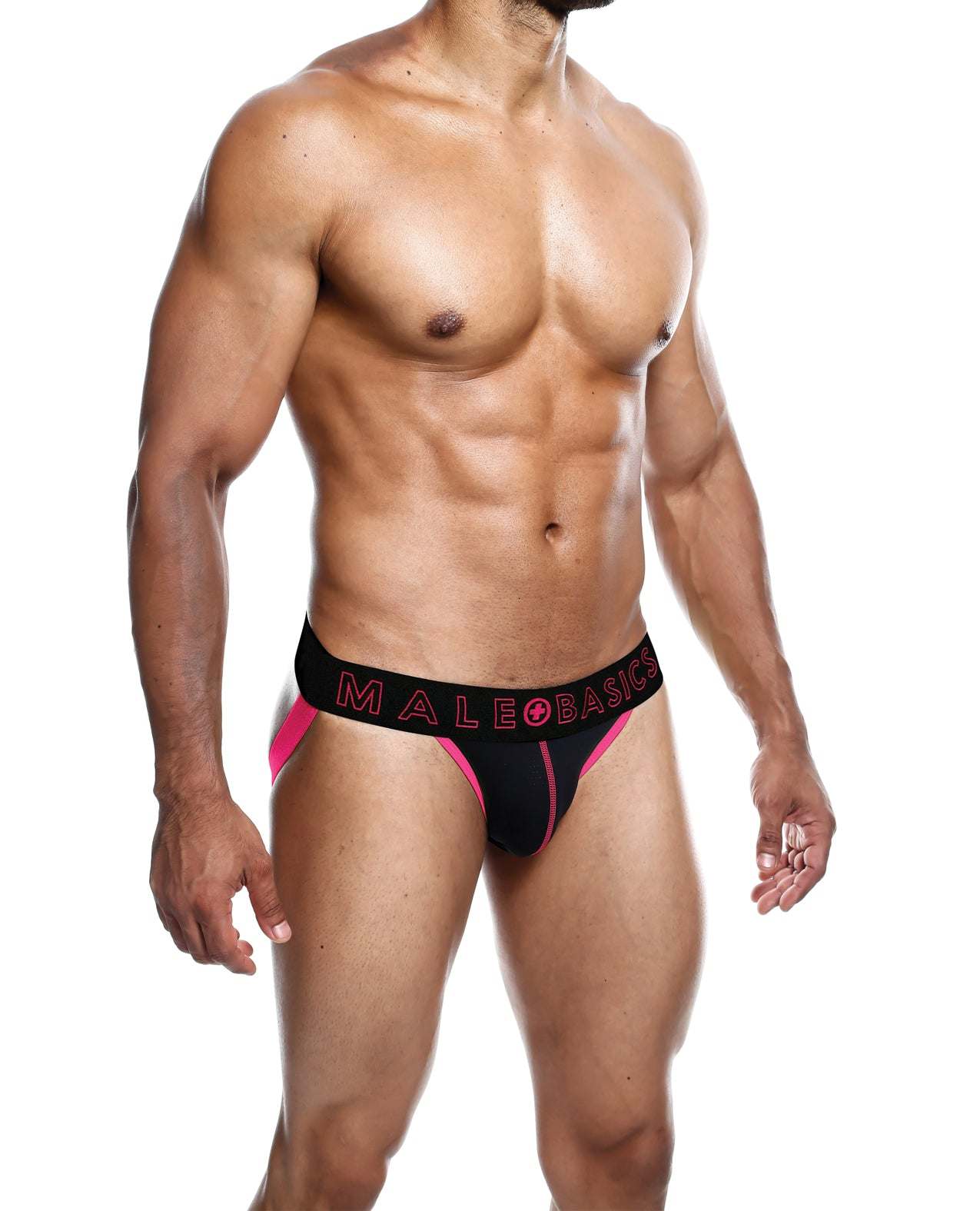 Male model wearing Male Basics Neon Jockstrap in coral and black with bold waistband and neon stitching design