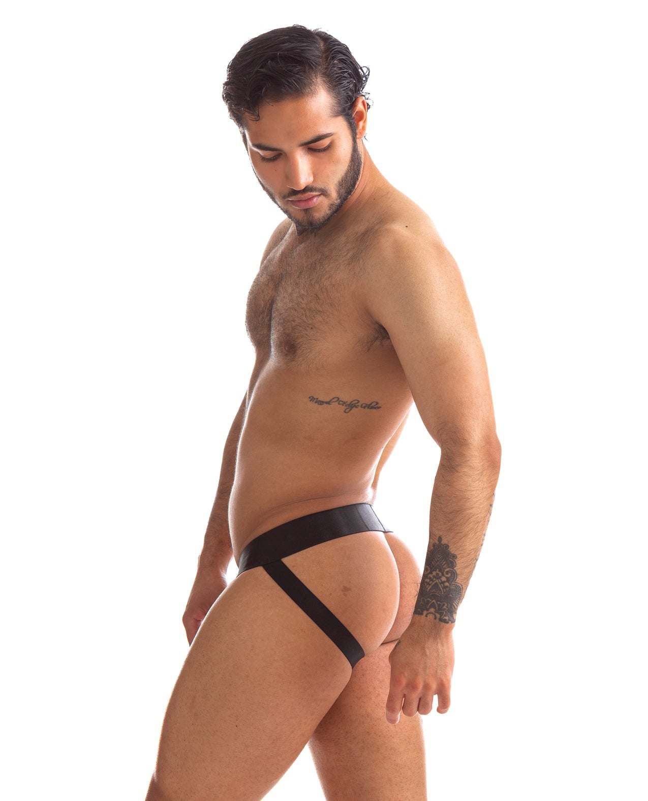 Side view of a man wearing a black 665 Stealth Jockstrap with elastic waistband and supportive straps, showcasing stylish and comfortable active underwear.
