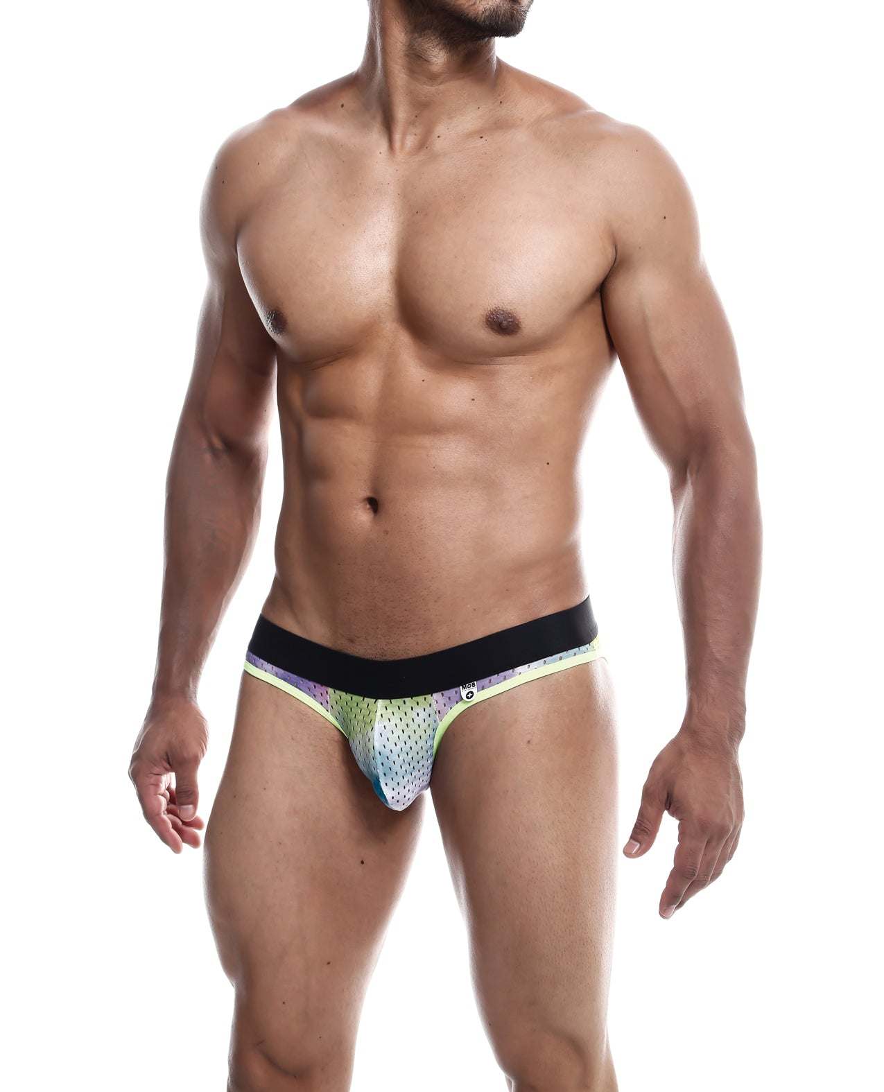 Male model wearing Male Basics MOB Aero Jock green dye athletic underwear with black waistband, showcasing minimal coverage and supportive fit.
