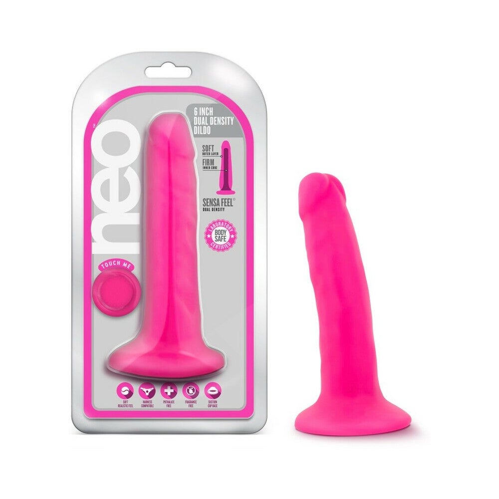 Neo 6 in. dual density dildo in neon pink with suction cup base, realistic texture, and harness compatible design.