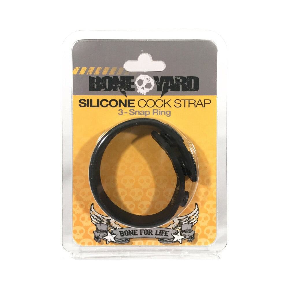 Boneyard black silicone cock strap with 3 snap rings in clear packaging on orange background