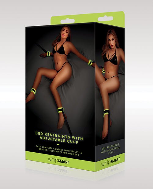 WhipSmart Glow in the Dark Bed Restraints with adjustable green cuffs for secure and comfortable bondage play