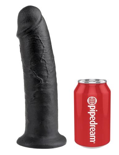 Black realistic dildo from King Cock Collection next to a red Pipedream soda can for size comparison