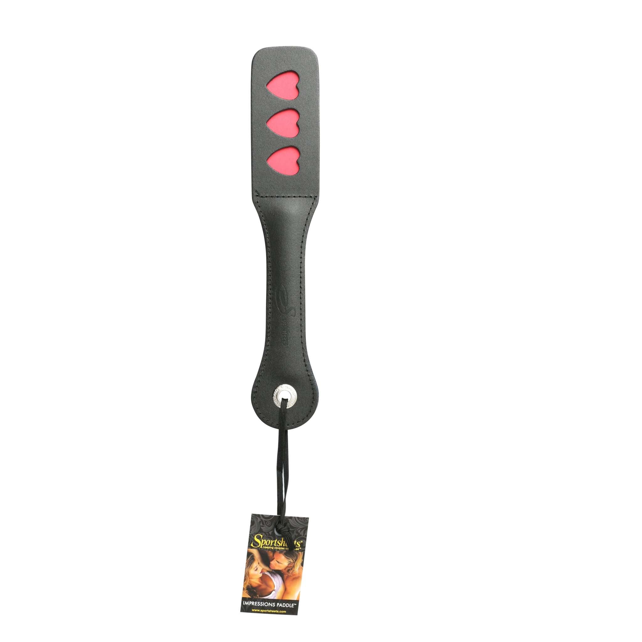 12 Inch Leather Impression Paddle - Heart with red heart-shaped imprints on black leather.