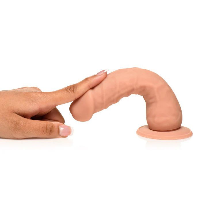 Easy Riders 7-inch silicone dildo with suction cup base and realistic texture being touched by a hand