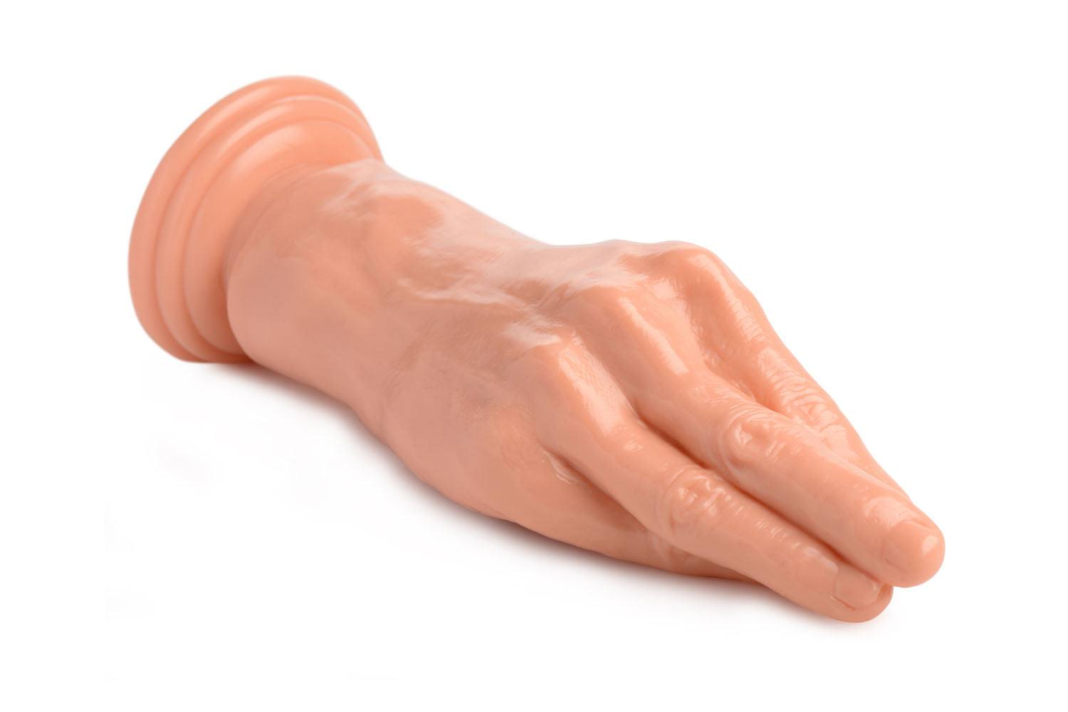Flesh-colored fisting hand dildo with suction cup base for hands-free use and realistic sensations