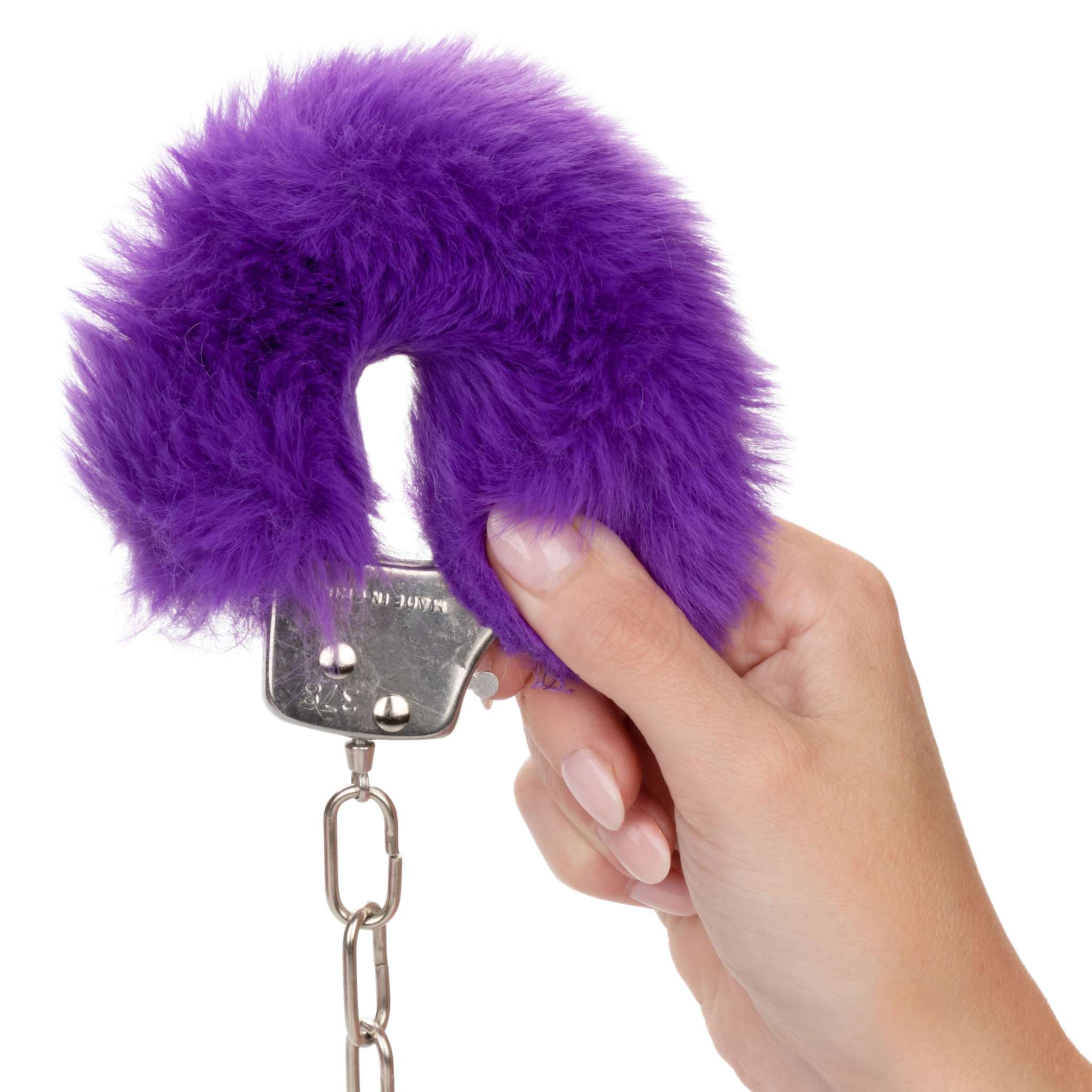 Hand holding purple Ultra Fluffy Furry Cuffs with soft faux fur covering metal restraint and chain