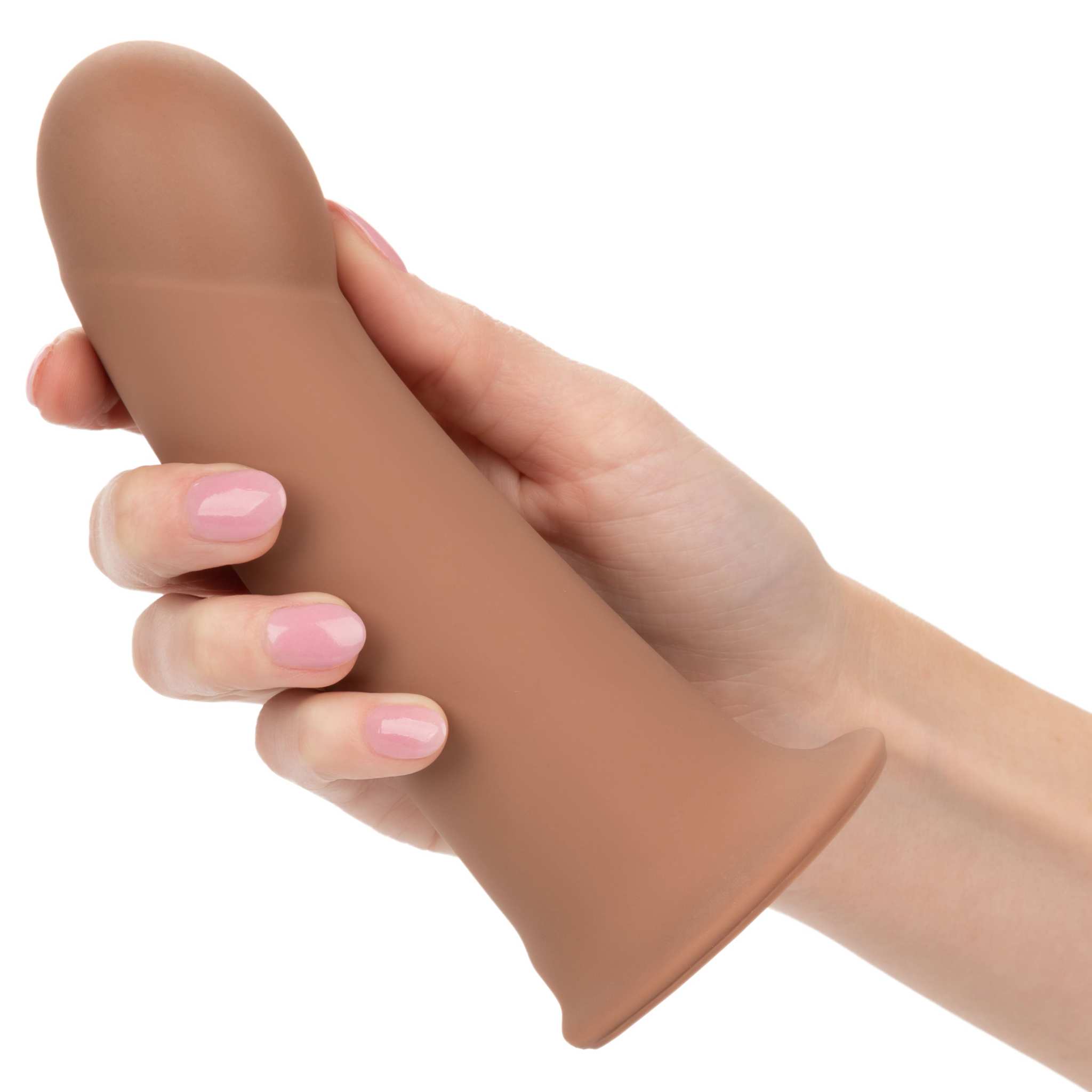 Hand holding brown Performance Maxx Extension silicone sleeve with smooth design and wide base.