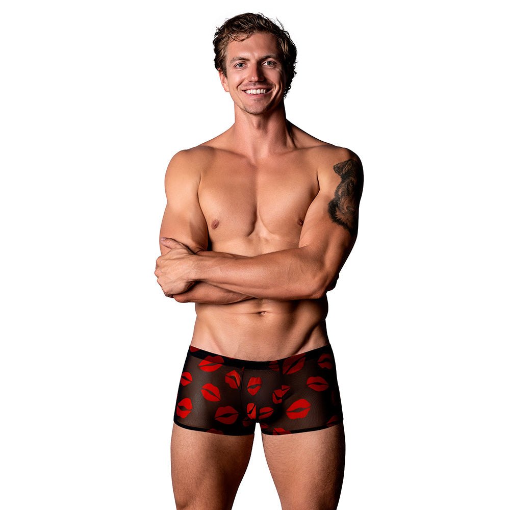 Male model wearing Male Power The Matchmaker Mini Short Sheer black shorts with red lips pattern