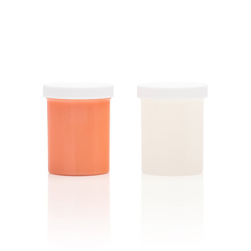 Two small containers of silicone refill material for Clone-A-Willy, one in light skin tone and one in white, with white screw-on lids.