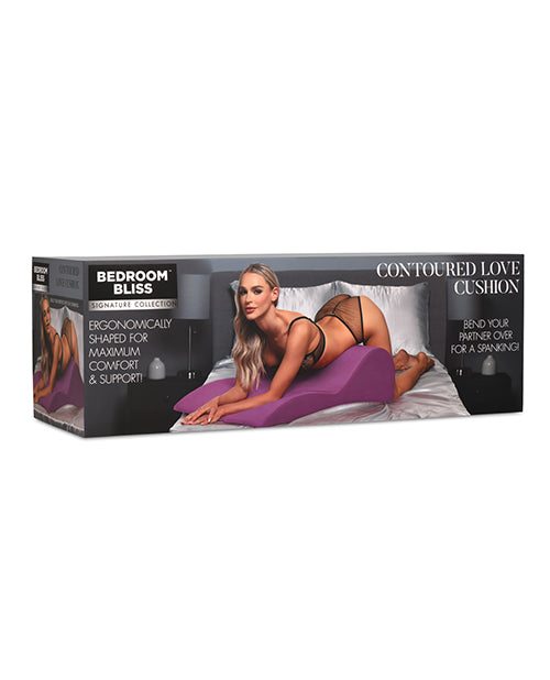 Packaging of Bedroom Bliss Contoured Love Cushion featuring ergonomic support and intimate positioning on a bed.