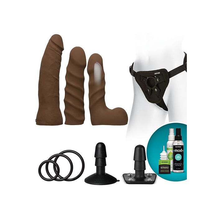 Vac-U-Lock Dual Density Starter Set in chocolate with three realistic attachments, harness, suction cup base, O-rings, toy cleaner, and refresh powder.