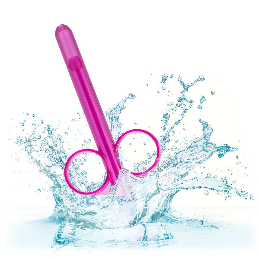 Purple Lube Tube with finger loops and plunger dispensing lubricant splash background