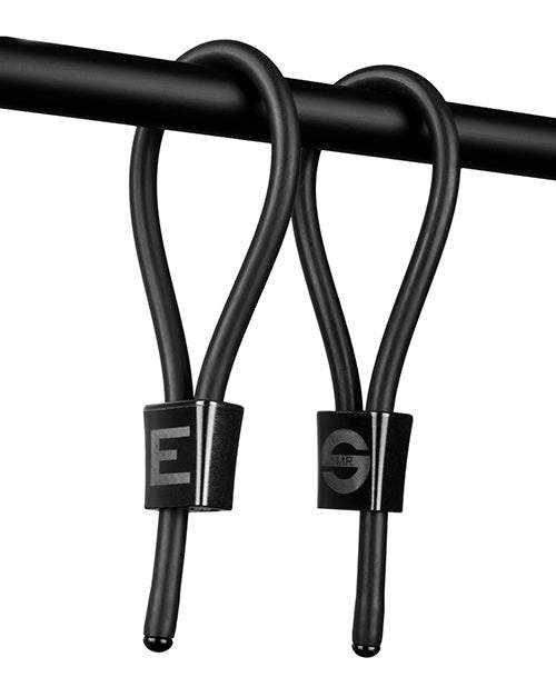 Black ElectraStim Accessory ElectraLoops Prestige adjustable rubber cock rings with aluminum chokes hanging on a rod