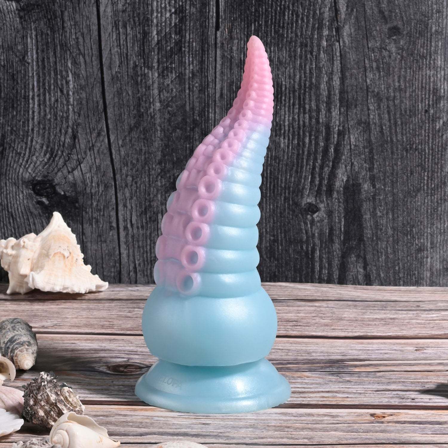 Stuck on You Multicolor flexible silicone tentacle vibrator with suction cup base on wooden surface