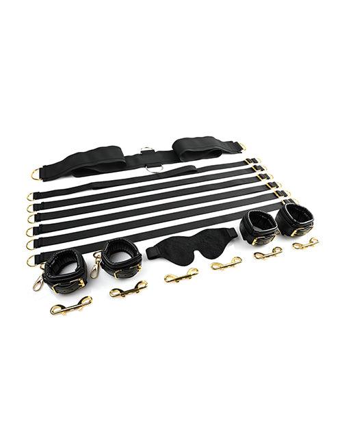 Under The Bed Restraint System with adjustable straps, faux leather cuffs, golden hardware, and velvet blindfold for secure and stylish bondage play.