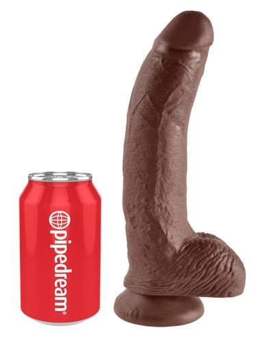 King Cock 9-Inch realistic brown dildo with balls and suction cup base next to a soda can for size comparison