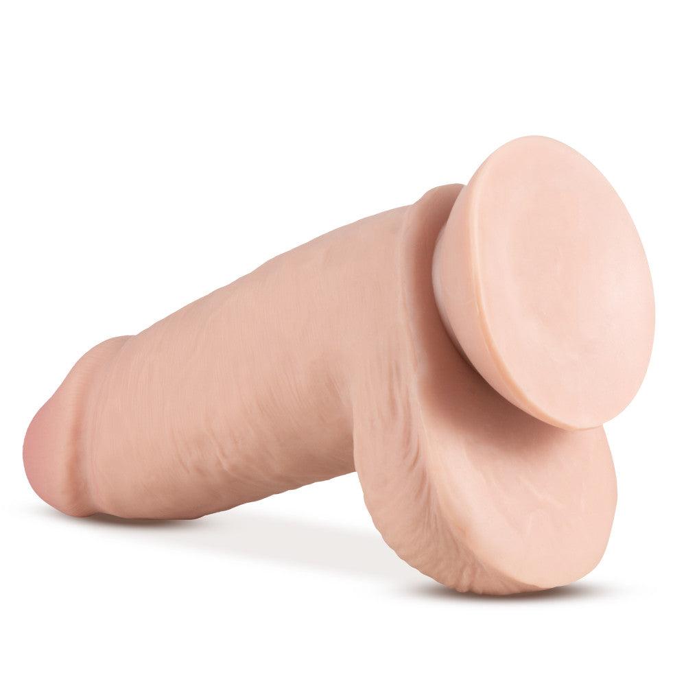 Au Naturel - 2.75 Pounder vanilla-colored realistic dildo with suction cup base and dual density technology.
