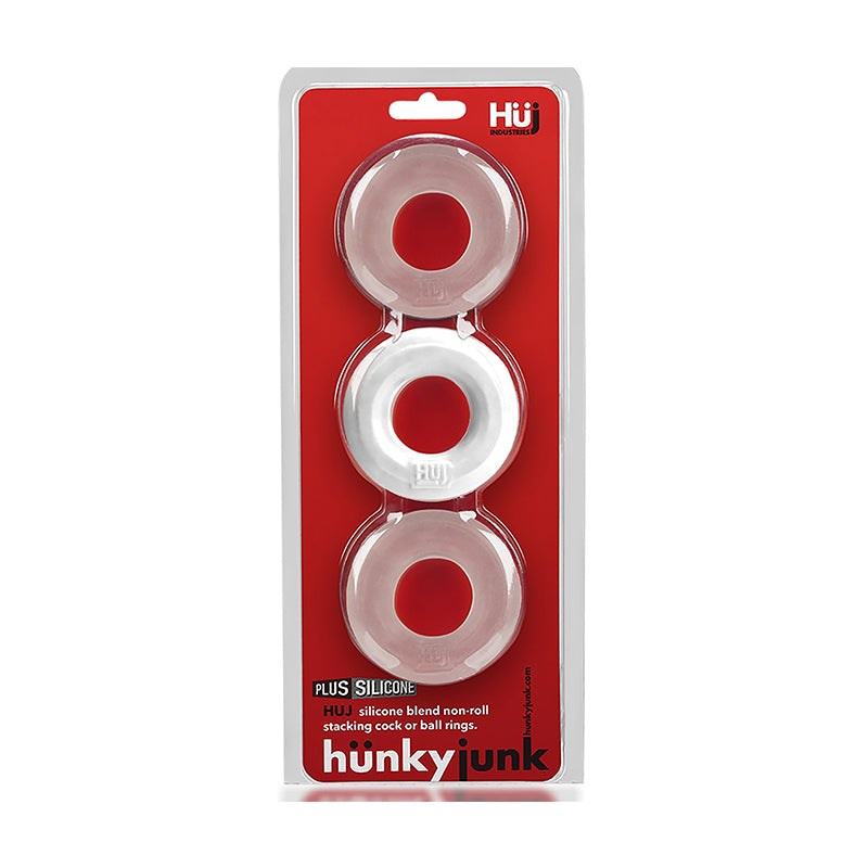 Hunkyjunk HUJ3 C-Ring 3-Pack made of plus+silicone blend, clear flexible rings for intimate use in transparent packaging with red background