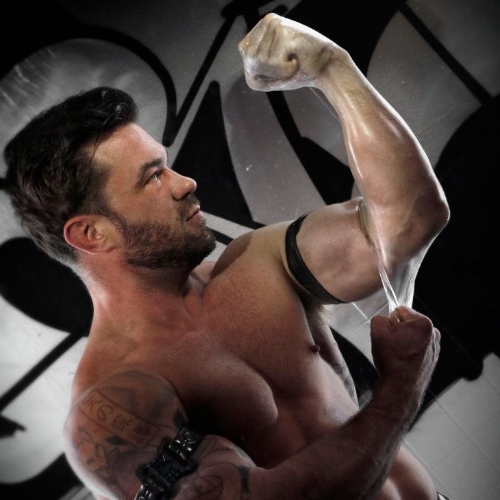 Man demonstrating the durable, stretchy Fort Troff FFister fingerless glove sheath designed for deep intimate play and comfort
