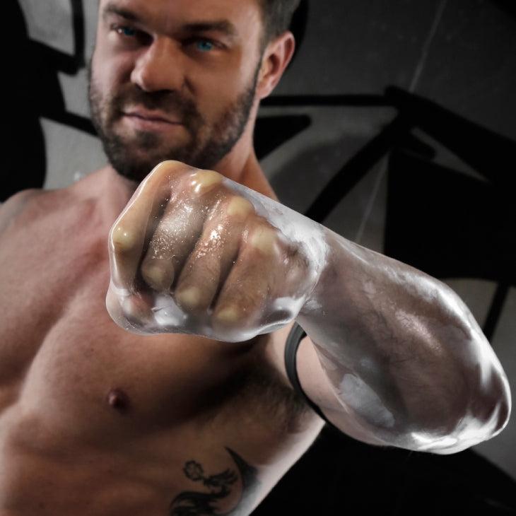 Man demonstrating Fort Troff FFister Frost fingerless cushioned sheath on arm for intimate play.