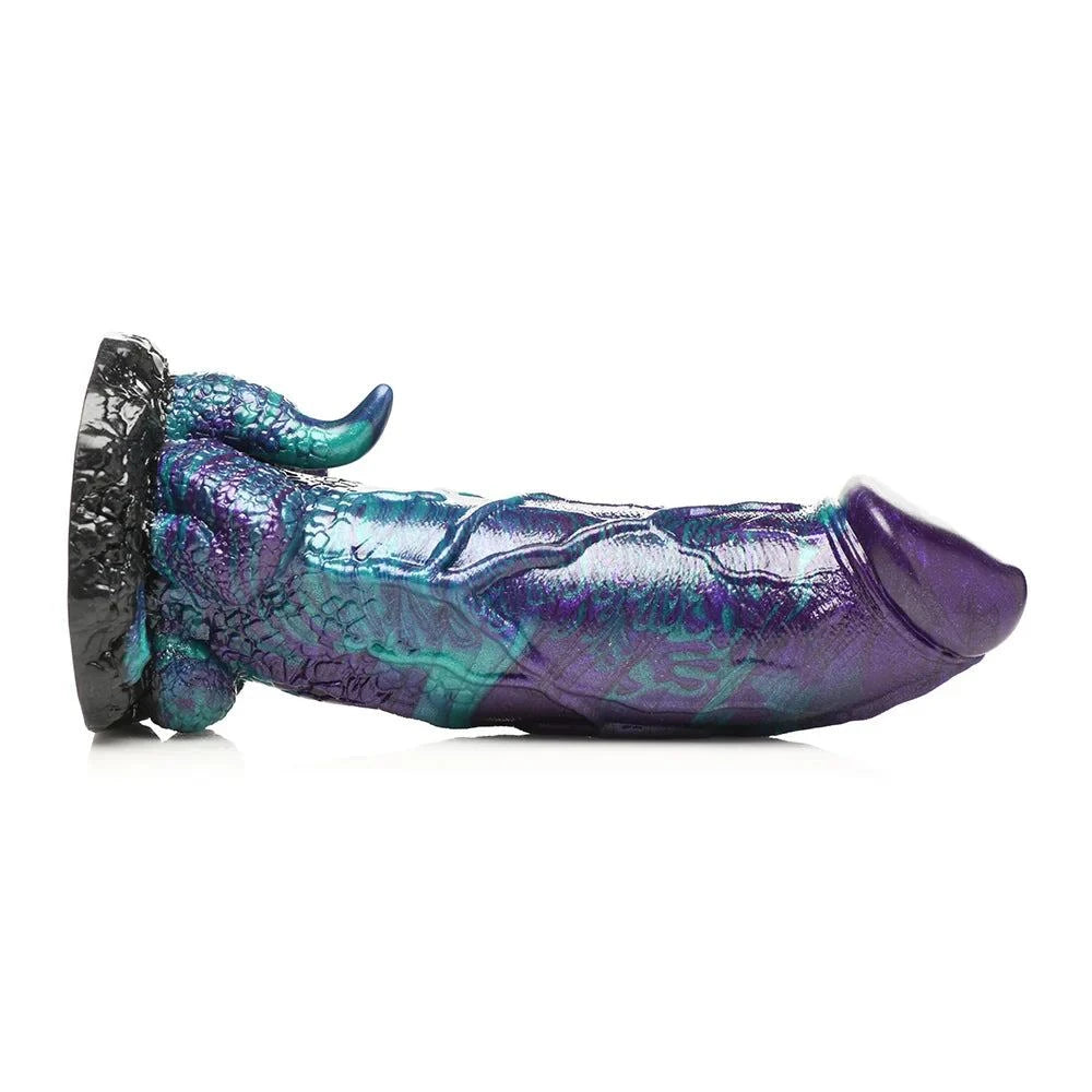 Colorful silicone dinosaur dildo with a textured shaft and suction base.