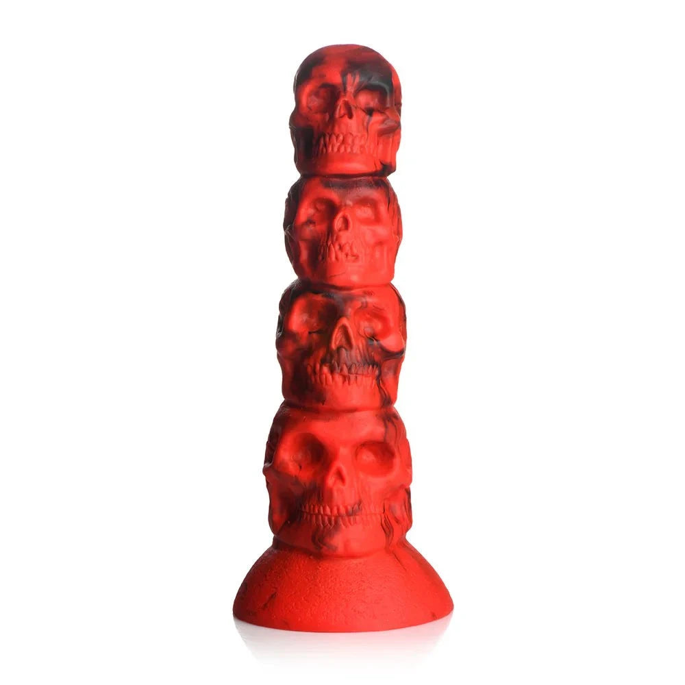 Red silicone fantasy dildo with stacked skull design and suction cup base.