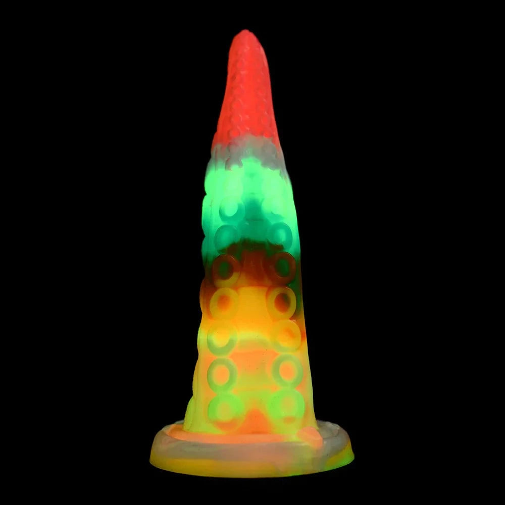 Glow-in-the-dark tentacle dildo with rainbow colors and textured design.