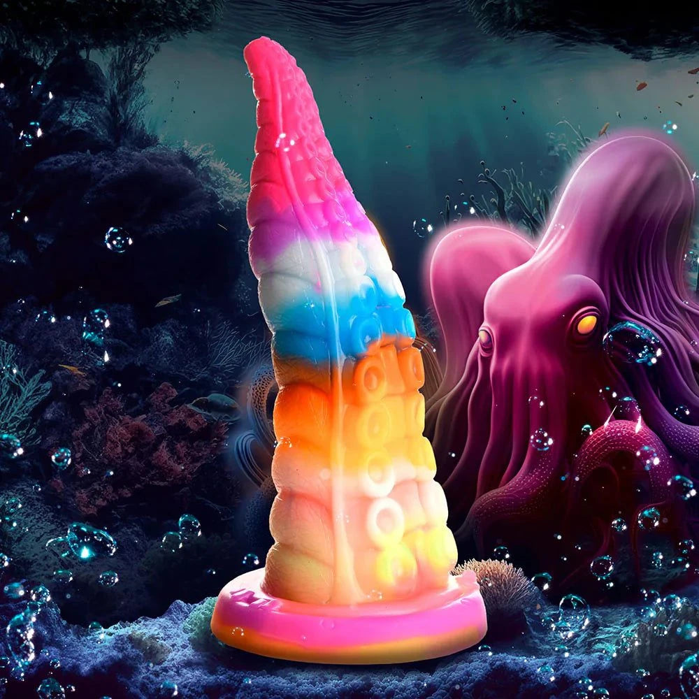 Creature Cocks Luminoctopus Glow-in-the-Dark Tentacle Dildo with vibrant colors and textured design, set in a fantasy underwater scene.