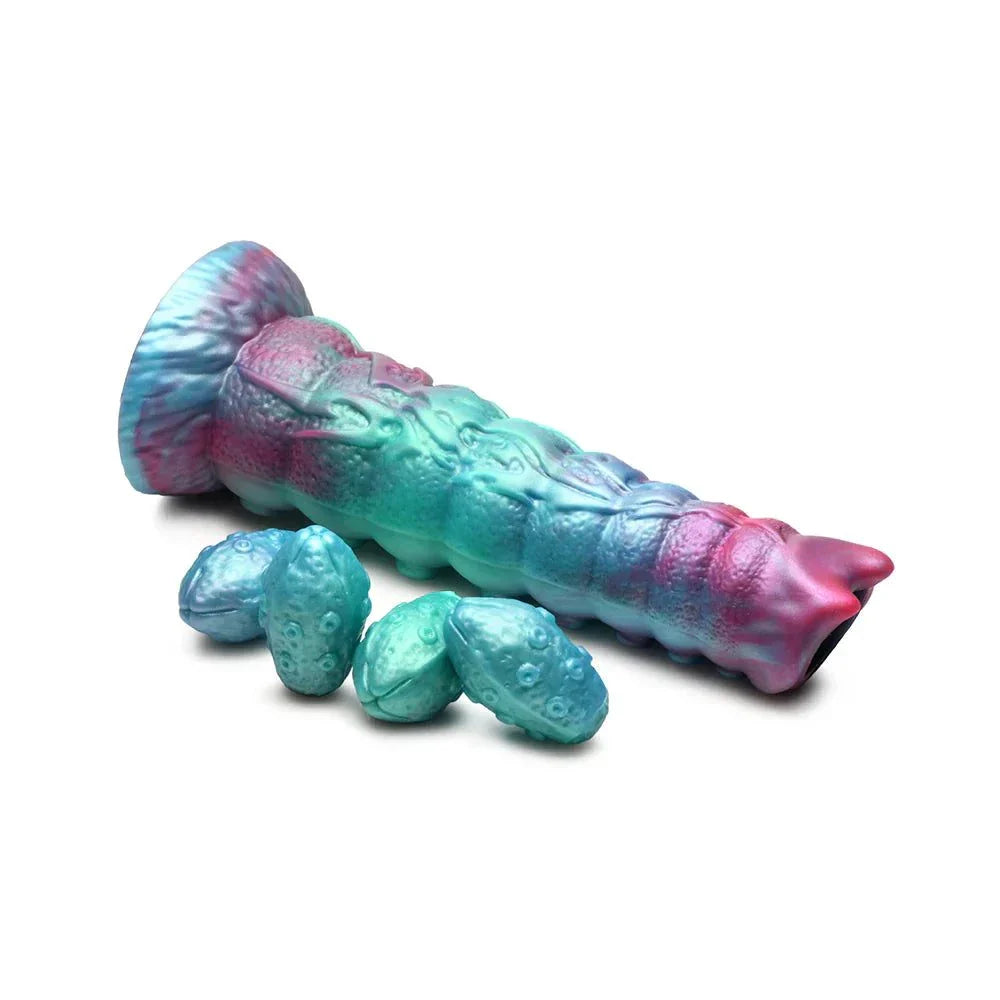 Galactic Breeder Ovipositor Silicone Dildo in teal, red, and blue with textured shaft and silicone eggs.