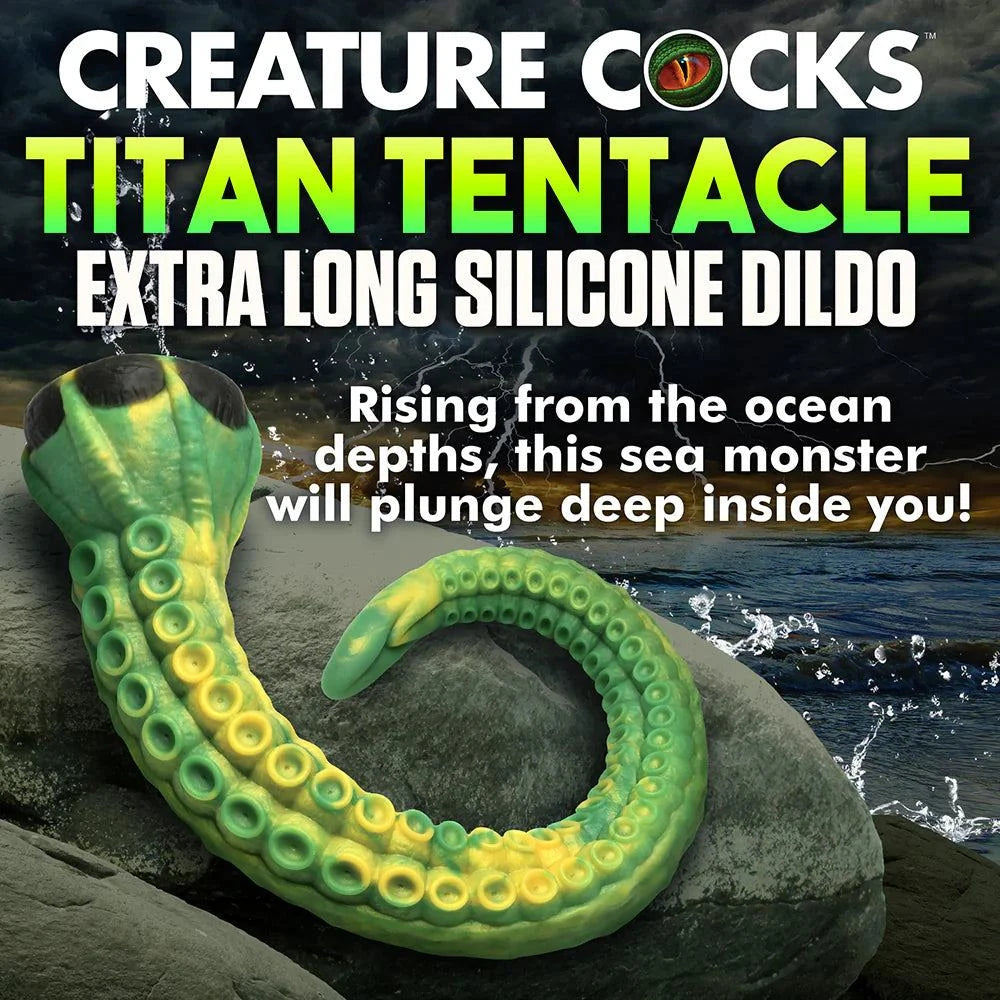 Green and yellow Creature Cocks Titan Tentacle extra long silicone dildo with textured suckers and suction cup base on rocky ocean shore background